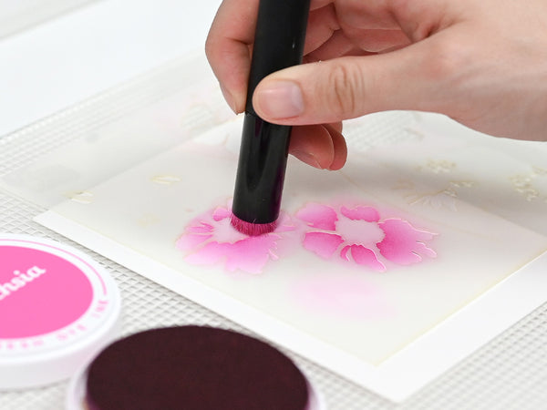 Apply ink, paste, or paint using a blending brush or palette knife.