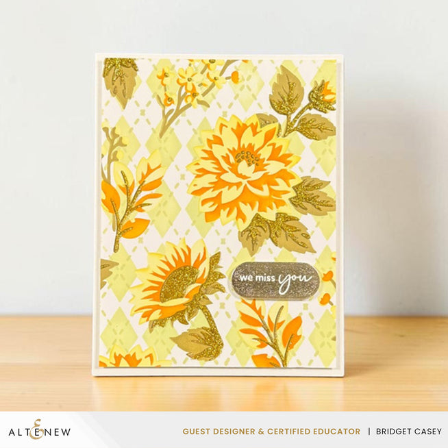 Altenew Botanical Argyle Layering Stencil Set with circular designs, gold glitter relief paste, displayed in a storage case.