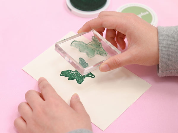 Lift the stamp straight up to prevent smearing, then wipe it clean.